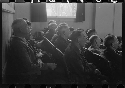 Untitled photo, possibly related to: Townspeople listening to discussion during town meeting, Woodstock, Vermont