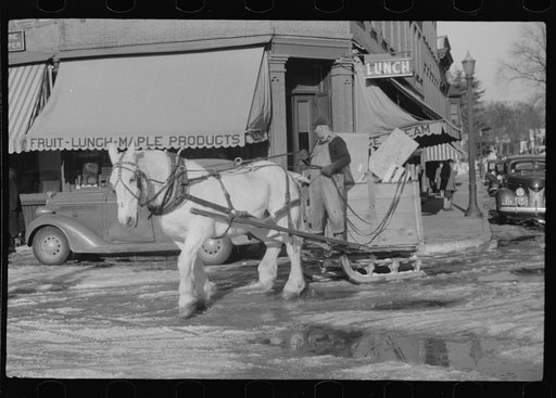 Collecting rubbish with sled in winter. Woodstock, Vermont