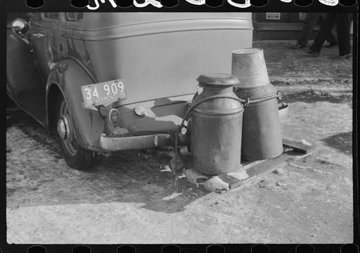 Untitled photo, possibly related to: Rear view of farmer's car in center of town, Woodstock, Vermont. Water is hauled since the usual supply has been frozen