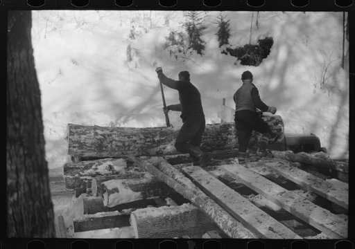 Untitled photo, possibly related to: Logs hauled by tractor to the road where they are picked up by truck and taken to the mill, near Barnard, Windsor County, Vermont