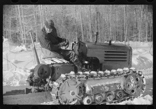 Hauling timber by tractor to the road where it is taken by truck to the mill. Near Barnard, Windsor County, Vermont