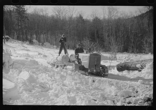 Hauling timber by tractor to the road where it is taken by truck to the mill. Near Barnard, Windsor County, Vermont