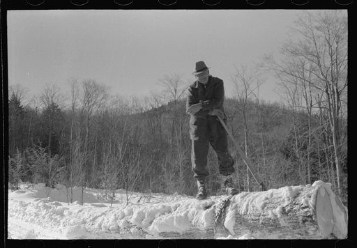 Untitled photo, possibly related to: Log being hauled by a tractor from woods to the road, where it will be loaded on a truck and taken to sawmill. Near Barnard, Vermont