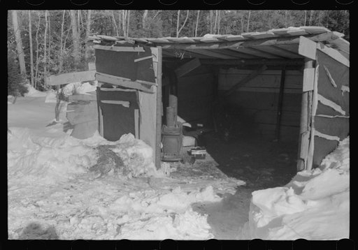 Untitled photo, possibly related to: Lumbermen's shack where they can get warm, eat their lunch, and house the tractor with which they haul logs to the road where they are picked up and hauled to the mill by truck. Near Barnard, Windsor County, Vermont