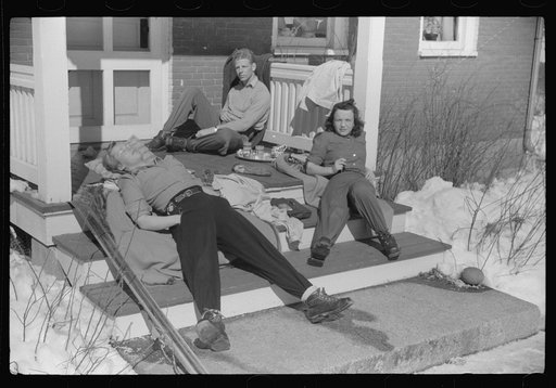 Untitled photo, possibly related to: Skiers on porch of Mr. Dickinson's home in Lisbon, Franconia, New Hampshire. He installed a ski tow on his property three years ago costing around one thousand dollars, and this is the first year he has made any money on it, but business is increasing rapidly now