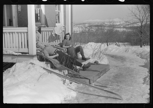 Untitled photo, possibly related to: Skiers on porch of Mr. Dickinson's home in Lisbon, Franconia, New Hampshire. He installed a ski tow on his property three years ago costing around one thousand dollars, and this is the first year he has made any money on it, but business is increasing rapidly now