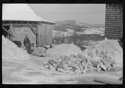 Untitled photo, possibly related to: Hired hand on Mr. Dickinson's farm, splitting logs for winter fuel. Lisbon, near Franconia, New Hampshire