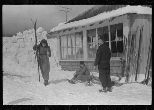Skiers during noon hour outside of toll house at foot of Mount Mansfield, Smugglers Notch. Near Stowe, Vermont