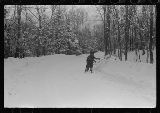 Untitled photo, possibly related to: Clearing off the sidewalk after the snowstorm in front of White Cupboard Inn, Woodstock, Vermont