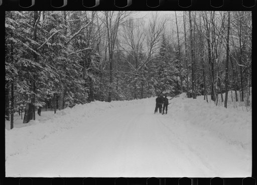 Untitled photo, possibly related to: Clearing off the sidewalk after the snowstorm in front of White Cupboard Inn, Woodstock, Vermont