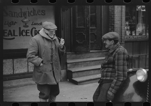 Townspeople of Woodstock, Vermont discussing the severe winter on the street corner in center of town