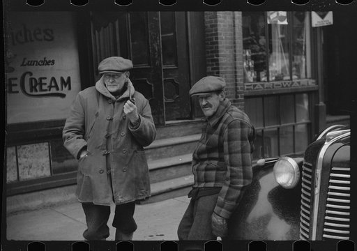 Untitled photo, possibly related to: Townspeople of Woodstock, Vermont discussing the severe winter on the street corner in center of town