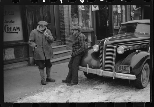 Untitled photo, possibly related to: Townspeople of Woodstock, Vermont discussing the severe winter on the street corner in center of town