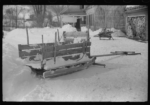 Untitled photo, possibly related to: Hauling water in milk cans because usual source of supply is frozen. Putney Homestead farm near Woodstock, Vermont