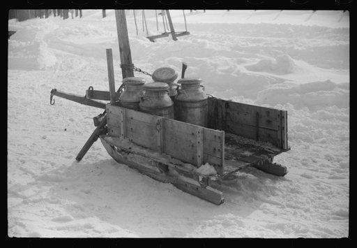 Untitled photo, possibly related to: Hauling water in milk cans because usual source of supply is frozen. Putney Homestead farm near Woodstock, Vermont