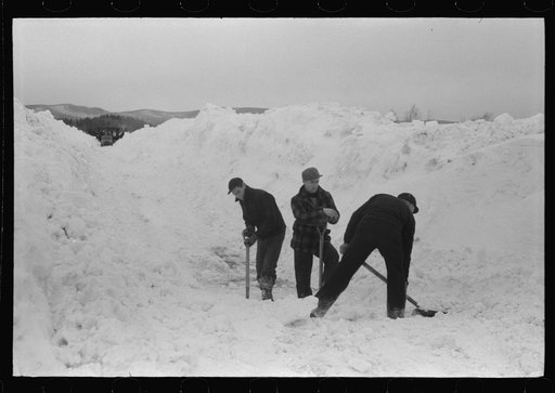 Untitled photo, possibly related to: Workmen dumping the ice and snow from streets of Berlin, New Hampshire into river