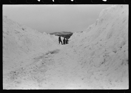 Untitled photo, possibly related to: Workmen dumping the ice and snow from streets of Berlin, New Hampshire into river