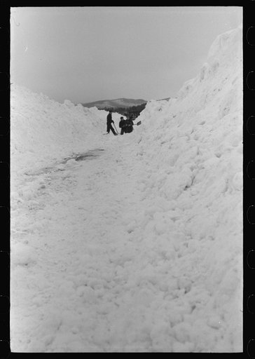 Untitled photo, possibly related to: Workmen dumping the ice and snow from streets of Berlin, New Hampshire into river