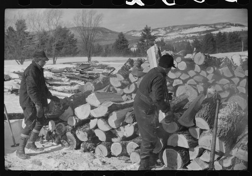 Splitting wood for winter fuel on farm near Littleton, New Hampshire