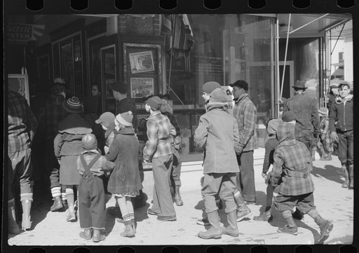 Children waiting to go into movie on Saturday afternoon, Littleton, New Hampshire