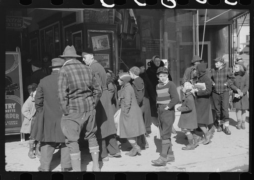 Children and farmers waiting to go into movie on Saturday afternoon, Littleton, New Hampshire