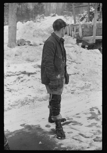 Untitled photo, possibly related to: Lumberman hauling logs to the mill in truck, near Littleton, New Hampshire