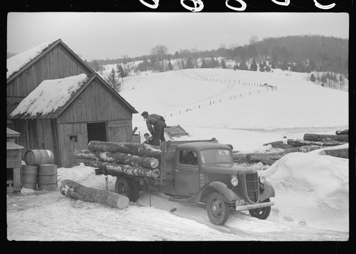 Truck picking up logs to be taken to the mill on farm near Waterbury, Vermont