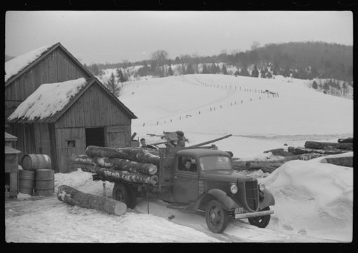 Untitled photo, possibly related to: Hired man hauling logs on farm near Waterbury, Vermont. They are then sold to the mill. He said "There ain't nothin' meaner than a log except a woman when she wants to be. They sure can be stubborn."
