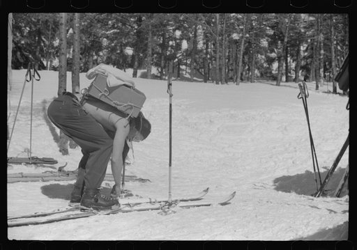 Forest ranger bringing in supplies which he has carried up the mountain on skiis to his hut which is also used by skiers in the winter. About half an hour later on his next trip down the mountain on skiis for more supplies he broke his leg. Near the top of Mount Mansfield, Smuggler's Notch, near Sto