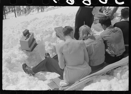 Untitled photo, possibly related to: Skiers relaxing in the sun during noon hour outside of forest ranger's hut near the top of Mount Mansfield, Smuggler's Notch, near Stowe, Vermont