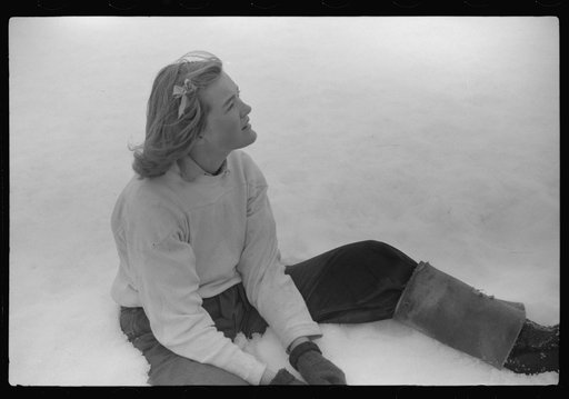 Young neighbor of Frank H. Shurtleff resting in the snow while gathering sap from sugar trees for making maple syrup. Sugaring is a social event and is enjoyed by all young people and children in the neighborhood. The Shurtleff farm has about 400 acres and was originally purchased by grandfather in 