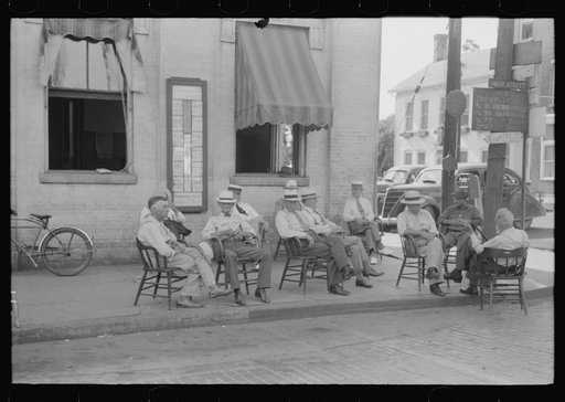 Untitled photo, possibly related to: Farmers exchange news and greetings in front of courthouse on Saturday afternoon. Versailles, Kentucky