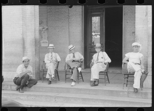 Untitled photo, possibly related to: Farmers exchange news and greetings in front of courthouse on Saturday afternoon. Versailles, Kentucky