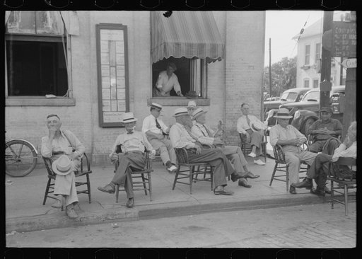 Untitled photo, possibly related to: Farmers exchange news and greetings in front of courthouse on Saturday afternoon. Versailles, Kentucky