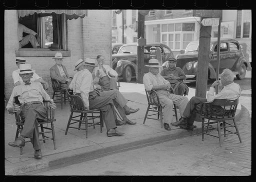Untitled photo, possibly related to: Farmers exchange news and greetings in front of courthouse on Saturday afternoon. Versailles, Kentucky
