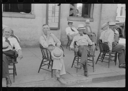 Untitled photo, possibly related to: Farmers exchange news and greetings in front of courthouse on Saturday afternoon. Versailles, Kentucky
