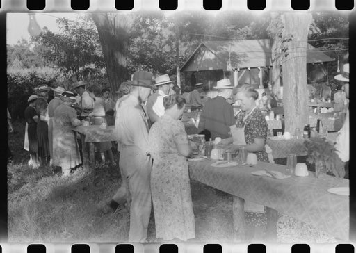 Untitled photo, possibly related to: Priest talking to one of the parishioners before a church supper. Near Bardstown, Kentucky