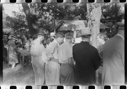 Untitled photo, possibly related to: Priest talking to one of the parishioners before a church supper. Near Bardstown, Kentucky