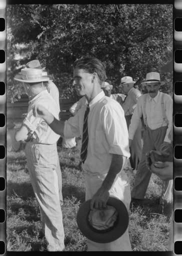 Untitled photo, possibly related to: Priest talking to one of the parishioners before a church supper. Near Bardstown, Kentucky