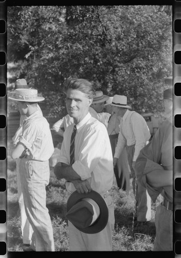 Untitled photo, possibly related to: Priest talking to one of the parishioners before a church supper. Near Bardstown, Kentucky