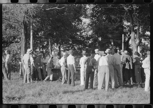 Untitled photo, possibly related to: Priest talking to one of the parishioners before a church supper. Near Bardstown, Kentucky