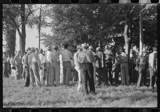 Untitled photo, possibly related to: Priest talking to one of the parishioners before a church supper. Near Bardstown, Kentucky