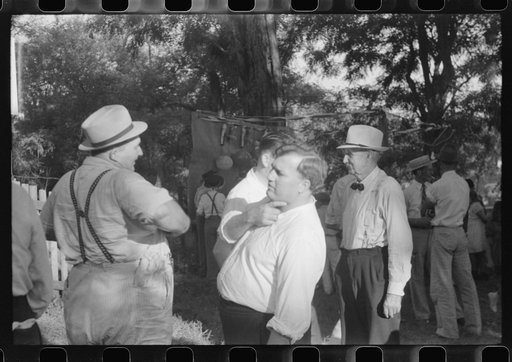 Untitled photo, possibly related to: Priest talking to one of the parishioners before a church supper. Near Bardstown, Kentucky