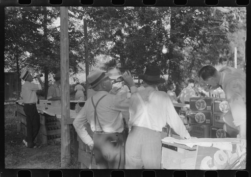 Untitled photo, possibly related to: Priest talking to one of the parishioners before a church supper. Near Bardstown, Kentucky