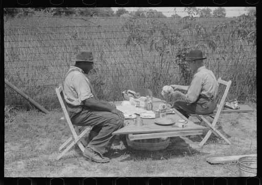 Untitled photo, possibly related to: Stable hand and trainer eating picnic lunch before the Shelby County Horse Show and Fair, Shelbyville, Kentucky
