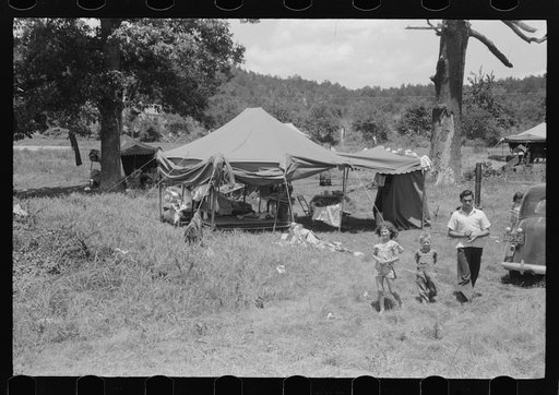 Itinerant repair man with family who goes around to the different farmers to mend their stoves. Near Lawrenceburg, Kentucky