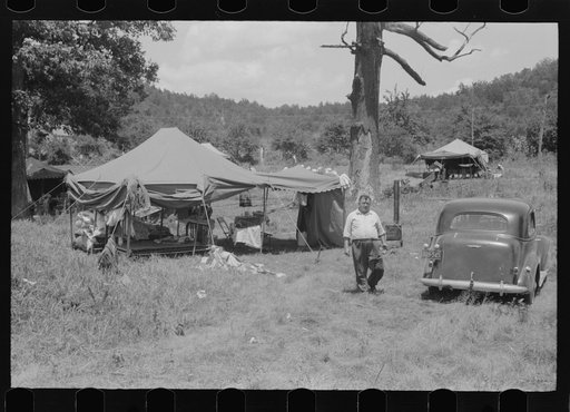 Itinerant repair man with family who goes around to the different farmers to mend their stoves. Near Lawrenceburg, Kentucky