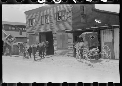 Untitled photo, possibly related to: Blacksmith shoeing team of farmhorses on Saturday, Russellville, Kentucky