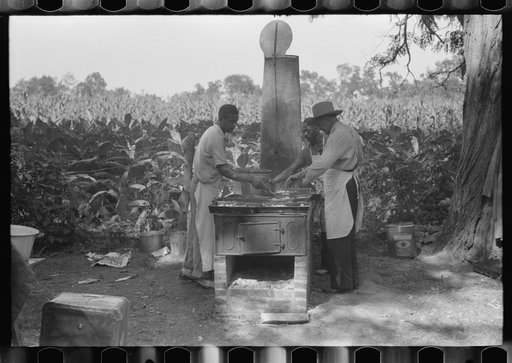 Untitled photo, possibly related to: Cooking fried supper for a benefit picnic supper on the grounds of St. Thomas' Church. Near Bardstown, Kentucky