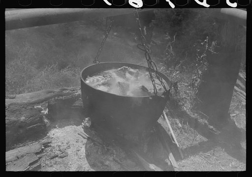 Untitled photo, possibly related to: Barbecuing beef and lamb for a benefit picnic supper on the grounds of St. Thomas' Church. Near Bardstown, Kentucky